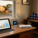 desk with tablet, thermostat, veteran's flag, and hat, symbolizing veteran utility assistance.