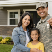 military veteran family smiling with keys to their new home, supported by veteran transitional housing grants.